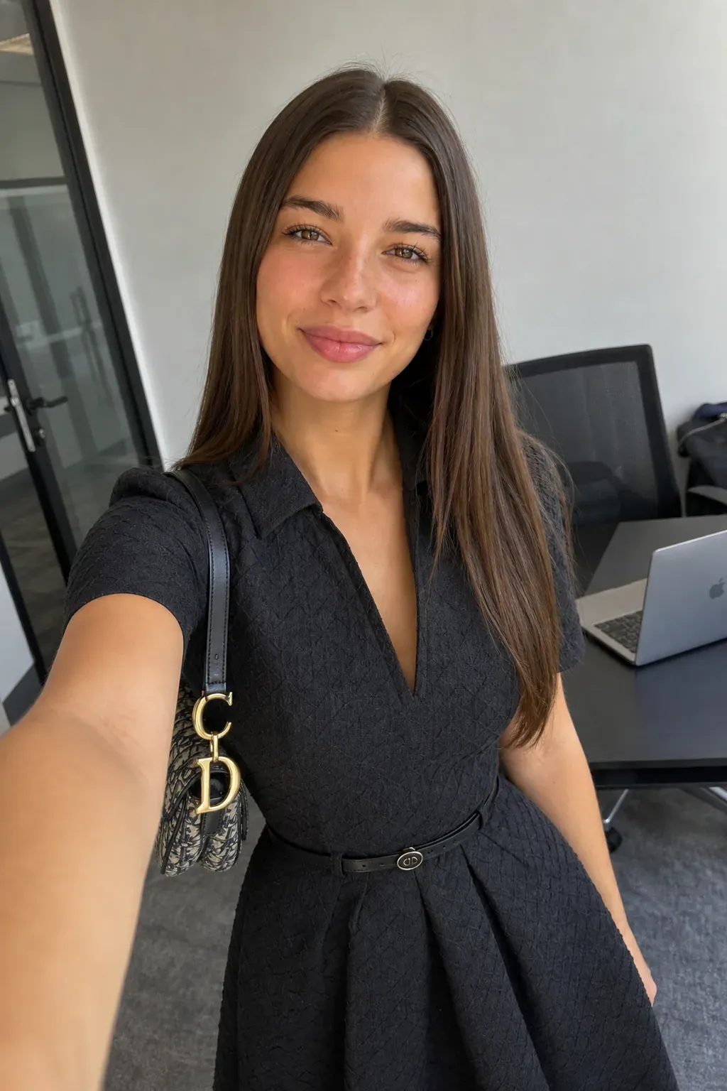 Lera Brune in an open-plan office, black belted shirt dress with Dior Saddle bag. AI character generated on Cladegrove